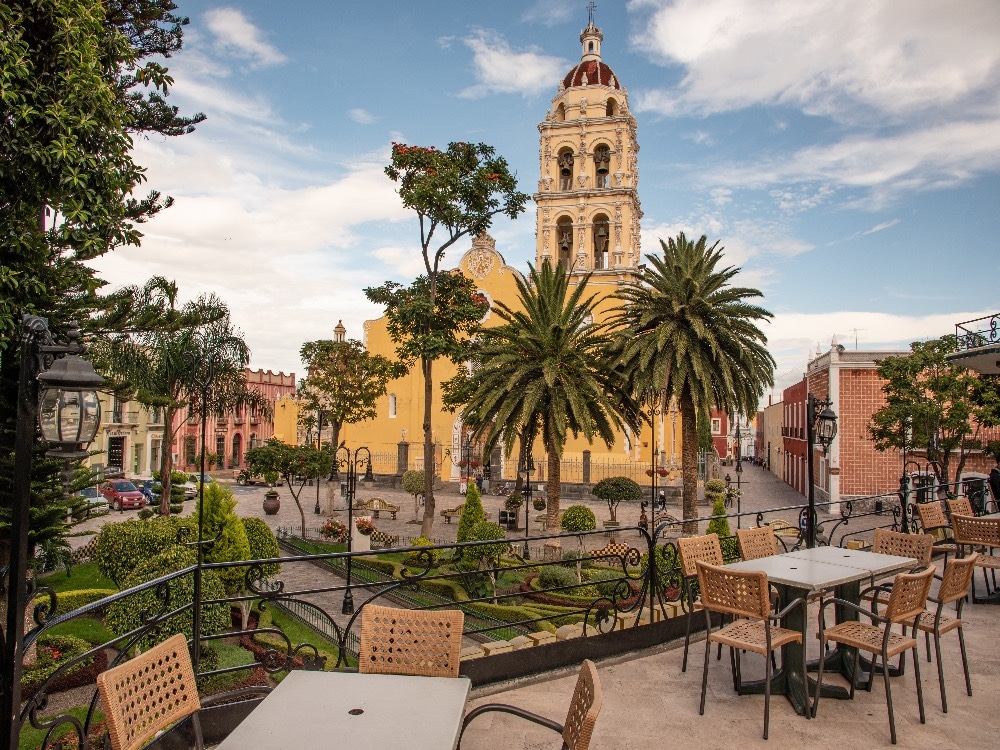 Shows historical centre in Puebla where you can have a coffee and enjoy the view